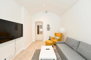 TV a/nebo společenská místnost v ubytování Kubelíkova 32 Residence