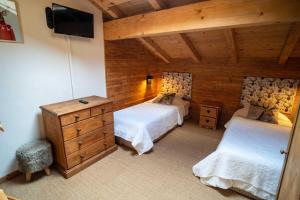Postel nebo postele na pokoji v ubytování Savoya Lodges