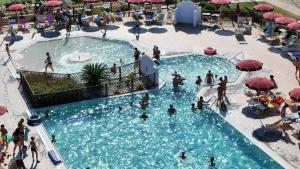 an overhead view of people in a pool at a resort at Rosa Dei Venti in Vada