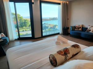 Postel nebo postele na pokoji v ubytování Hotel Delfin Azul