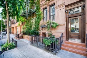 a building with a door and ivy at Kips Bay 1BR w WD nr E River 6 Train NYC-829 in New York