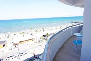 a view of the beach from the balcony of a condo at Quattro Beachfront Sea View Ap 53 in Larnaka