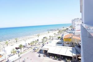 a view of a beach from a building at Quattro Beachfront Sea View Ap 53 in Larnaka