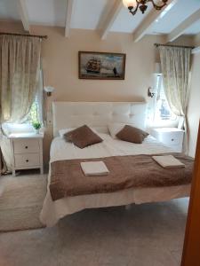 a bedroom with a large white bed with two pillows at Apartments in a "VILLA VISTA JAVEA" in Jávea