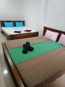 Llit o llits en una habitació de Sashen Hotel