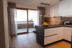 A kitchen or kitchenette at Appartement Sonnlicht