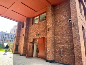 a brick building with a red door on it at Bjørvika - Beside the sea & in the city, near Oslo Centralstation in Oslo