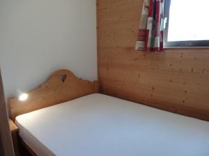 Кровать или кровати в номере Appartement Les Menuires, 2 pièces, 4 personnes - FR-1-178-29