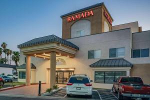 a car parked in front of a hotel at Ramada by Wyndham Bakersfield in Bakersfield