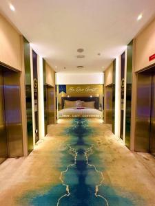 a hotel room with a pool of water on the floor at Kuching Kozi Square Apartment III in Kuching