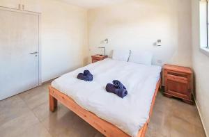 Postel nebo postele na pokoji v ubytování BnBIsrael apartments - Masaryk Musk