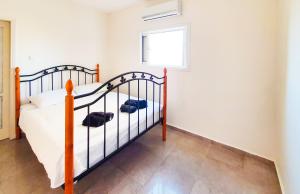 Postel nebo postele na pokoji v ubytování BnBIsrael apartments - Masaryk Musk