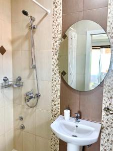 a bathroom with a sink and a mirror at Apartments Pendik in Ohrid