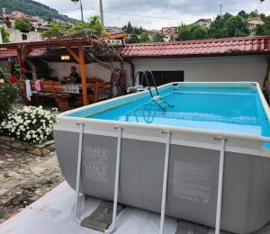 a swimming pool on top of a building at Ismar Residence in Sarajevo