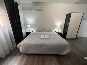 Cama o camas de una habitación en Apartamentos Arapiles