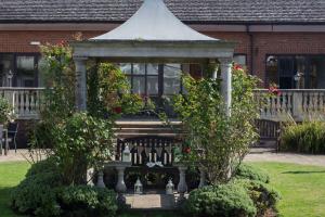 a gazebo in the yard of a house at DoubleTree by Hilton Oxford Belfry in Thame