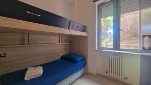 Кровать или кровати в номере WH - Bussana