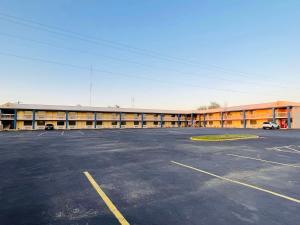 an empty parking lot in front of a building at SureStay Hotel by Best Western Childress in Childress