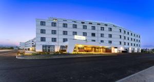 a large white building with a street in front of it at PLAZA INN Wiener Neustadt, BW Signature Collection in Wiener Neustadt