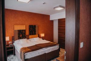Ένα ή περισσότερα κρεβάτια σε δωμάτιο στο Hotel BELASSI