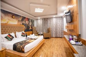 A bed or beds in a room at Hotel Smugglers Mountain View - central heated & air Cooled #Free Pick from Volvo Bus Stand