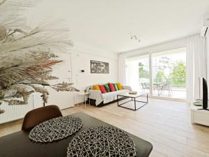 a living room with a couch and a table at Marathonomachon Apartments by Verde Apartments in Athens