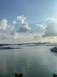 a large body of water with boats in it at Mom's home in Pasir Gudang