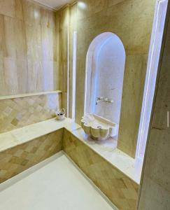 a bathroom with a sink and a mirror at Dar Oliva Maison de luxe in Houmt Souk