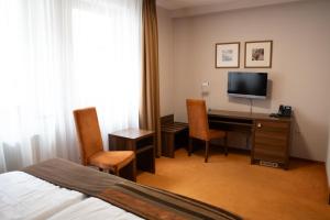 Μια τηλεόραση ή/και κέντρο ψυχαγωγίας στο Hotel BELASSI