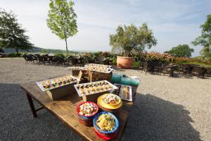 a table with different types of food on it at Parco di Montebello in Quattro Castella