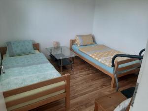 A bed or beds in a room at Wohnung Rheintal im Alpenvorland