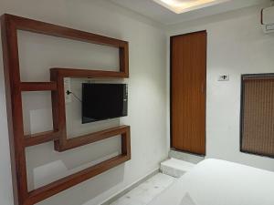 Postel nebo postele na pokoji v ubytování Hotel Palms Residency, Chembur Mumbai