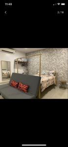 a bedroom with a bed with two pillows on it at Cozy Skyview DillaSuite-Trefoil (Wifi,Pool,Netflix) in Shah Alam +26 photos