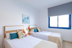 Posteľ alebo postele v izbe v ubytovaní Alicante Hills Premium