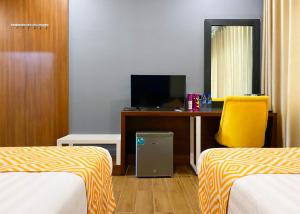 Postel nebo postele na pokoji v ubytování Holiday Pier Hotel