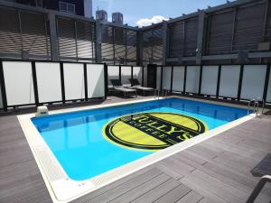 a swimming pool on the roof of a building at APA Hotel & Resort Nishishinjuku-Gochome-Eki Tower in Tokyo