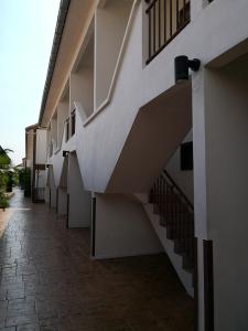 an empty hallway with stairs on a building at Alpine LXPD Water Chalet in Port Dickson