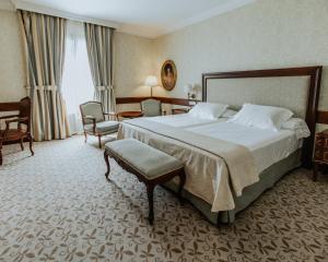 Postel nebo postele na pokoji v ubytování Hotel Cándido
