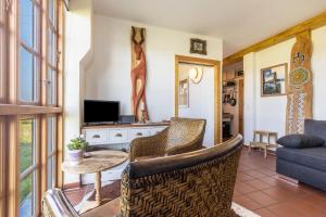 a living room with a couch and a table at Apartment Lüneburger Heide in Hankensbüttel