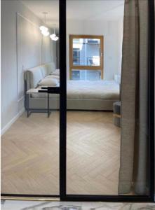 Posteľ alebo postele v izbe v ubytovaní Prestige Apart Gdańsk