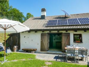 a house with solar panels on the roof at Holiday Home Rustico Girasole by Interhome in Leontica +28 photos