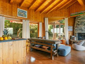 a kitchen with a table in the middle of a room at Chalet Chalet Mayens by Interhome in Agettes