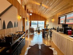 a large room with a kitchen and a dining room at Bledford Chiloé in Castro