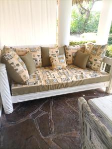 a couch on the porch of a house at Sophia house in Malindi