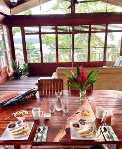 a wooden table with food on top of it at Akwaba Lodge in The Gap