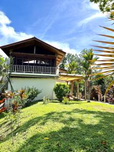 a house with a grass yard in front of it at Akwaba Lodge Island Boutique Hotel in The Gap +53 photos