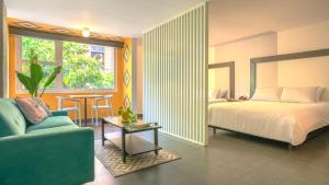 Ένα ή περισσότερα κρεβάτια σε δωμάτιο στο Hotel El Peñon by Bithotels