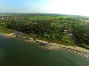 an aerial view of an island in the water at Nilamba Beach Resort in Kovvankulam