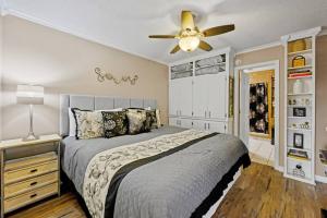 a bedroom with a bed and a ceiling fan at Secluded Cabin / Stunning Mtn View / Paved Drive in Sevierville