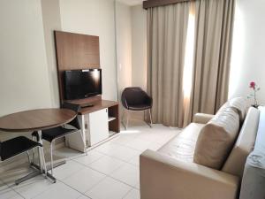 Μια τηλεόραση ή/και κέντρο ψυχαγωγίας στο Privé Boulevard Suites Viaje Bem